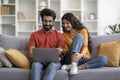 Portrait Of Happy Young Indian Spouses Using Laptop At Home Together Royalty Free Stock Photo