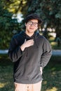 Portrait of happy young male student with glasses in casual outfit Royalty Free Stock Photo