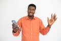 Portrait of happy young man in headphones holding mobile phone Royalty Free Stock Photo