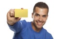 Portrait of happy young man, holding empty credit card on white Royalty Free Stock Photo