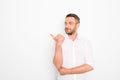 Portrait of happy young man pointing with finger Royalty Free Stock Photo