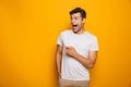 Portrait of a happy young man pointing fingers away Royalty Free Stock Photo