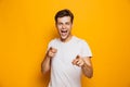 Portrait of a happy young man pointing fingers at camera Royalty Free Stock Photo