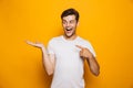 Portrait of a happy young man pointing fingers Royalty Free Stock Photo