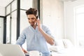 Portrait of a happy young man using laptop computer Royalty Free Stock Photo