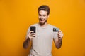 Portrait of a happy young man using mobile phone Royalty Free Stock Photo