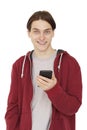 Portrait of happy young man using smartphone, smiling and looking at camera isolated on white background Royalty Free Stock Photo