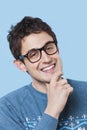 Portrait of happy young man wearing novelty glasses Royalty Free Stock Photo