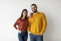 Portrait Of Happy Young Man And Woman Posing Over White Wall Background Royalty Free Stock Photo