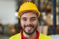 Portrait of happy young man working in delivery warehouse