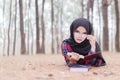 Portrait of happy young muslim woman black hijab and Scottish shirt