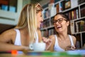 Portrait of happy young people studying together in a library. Education study teenager concept Royalty Free Stock Photo