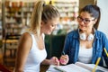 Portrait of happy young people studying together in a library. Education study teenager concept Royalty Free Stock Photo