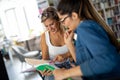 Portrait of happy young people studying together in a library. Education study teenager concept Royalty Free Stock Photo