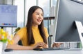 Portrait happy young programmer Asian woman work at start up technology office and using computer for coding application program Royalty Free Stock Photo