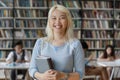 Portrait of happy young smart Asian female student. Royalty Free Stock Photo