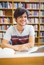 Portrait of happy young student using his laptop Royalty Free Stock Photo