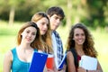 Portrait happy young students in park Royalty Free Stock Photo