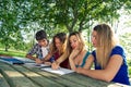 Portrait happy young students in park Royalty Free Stock Photo