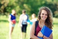 Portrait happy young students in park Royalty Free Stock Photo