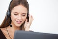 Portrait of happy young support phone operator with headset. Royalty Free Stock Photo