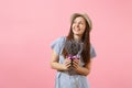 Portrait of a happy young tender woman in blue dress, hat holding bouquet of beautiful purple lavender flowers isolated Royalty Free Stock Photo