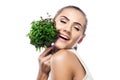 Portrait of happy young woman with a bundle of fresh mint