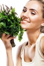 Portrait of happy young woman with a bundle of fresh mint