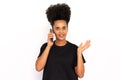 Portrait of happy young woman calling friend on mobile phone Royalty Free Stock Photo