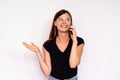 Portrait of happy young woman calling friend on mobile phone Royalty Free Stock Photo