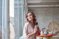 Portrait of a happy young woman with chocolate bar in modern interior room Royalty Free Stock Photo