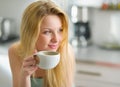 Portrait of happy young woman drinking coffee Royalty Free Stock Photo