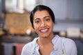 Portrait of happy young woman with flour on nose