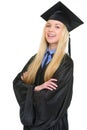 Portrait of happy young woman in graduation gown Royalty Free Stock Photo