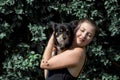 Portrait of happy young woman with her cute dog Royalty Free Stock Photo