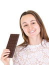 Portrait of a happy young woman holding chocolate bar Royalty Free Stock Photo