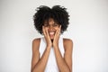 Portrait of happy young woman holding head in hands Royalty Free Stock Photo