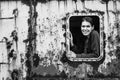 Portrait of happy young woman in industrial zone.