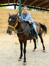 Woman riding bay horse Royalty Free Stock Photo