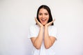 Portrait of happy young woman looking at camera in admiration Royalty Free Stock Photo