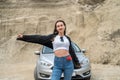 Portrait of happy young woman near car Royalty Free Stock Photo