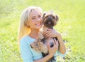 Portrait of happy young woman owner with yorkshire terrier dog Royalty Free Stock Photo