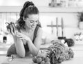 Happy young woman ready to make fresh vegetable sala Royalty Free Stock Photo