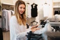 Portrait of happy woman shopping clothes in a store. Shopping people sale fashion concept Royalty Free Stock Photo