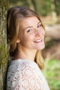 Portrait of a happy young woman smiling outdoors Royalty Free Stock Photo