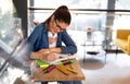 Portrait of happy young female studying in a library. Education study teenager concept Royalty Free Stock Photo