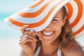 Portrait of happy young woman in swimsuit and beach hat Royalty Free Stock Photo
