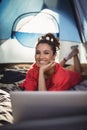 Portrait of happy young woman in tent Royalty Free Stock Photo