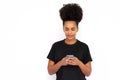 Portrait of happy young woman texting message on mobile phone Royalty Free Stock Photo