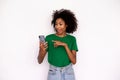 Portrait of happy young woman texting message on mobile phone Royalty Free Stock Photo